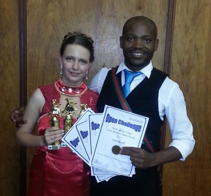 Jayne with her trophies and dance partner.