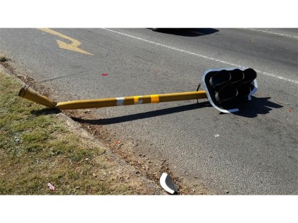 The Mazda did a 360 degree turn and hit the traffic light.