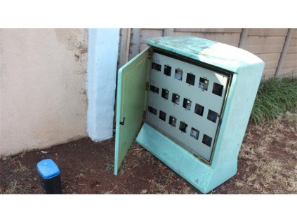 The meter on the left and the electrical box left open on the right.