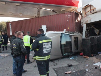 The Mercedes was pushed with enough force to tip it over with driver and passenger inside.