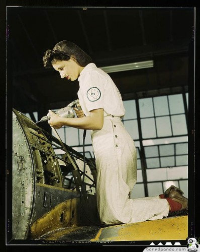 Oyida Peaks riveting as part of her NYA training to become a mechanic at the Naval Air Base, Assembly and Repair Department, Corpus Christi, Texas 1942 August, photographer: Hollem Howard R.