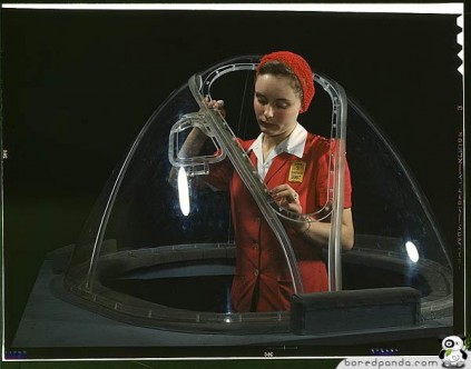 This girl in a glass house is putting finishing touches on the bombardier nose section of a B-17F navy bomber, Long Beach, Calif. She's one of many capable women workers in the Douglas Aircraft Company plant. 1942 Oct. photographer: Palmer, Alfred T.
