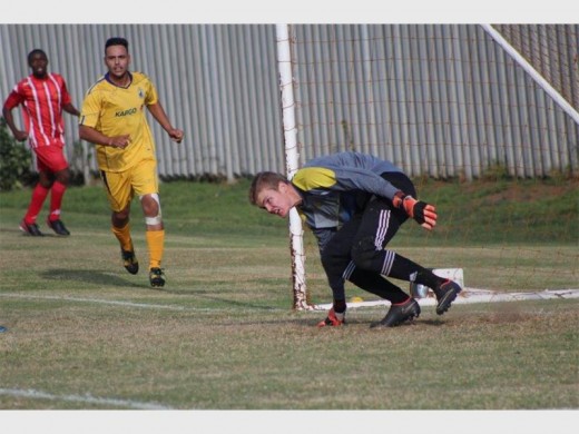 GUARDING THE GOAL POST: Alberton FC’s young goalkeeper Bevin Cowdy had a busy game guarding the goal area against Highlands Park.