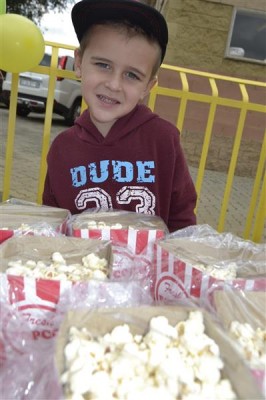 Ethan de la Reys 3year old sister, Peyton helped him to sell his marshmellows and popcorn.