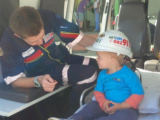 EXPLORING : Caleb Rowley has fun while sitting inside an ambulance.