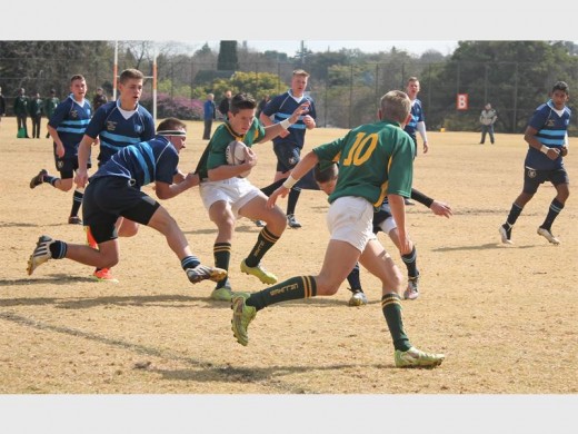 NOT GOING ANYWHERE: Alberton High School’s rugby players try to stop the Hoërskool Carletonville players from reaching the tryline.