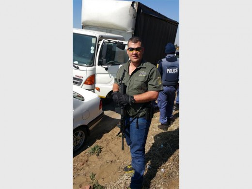 QUICK REACTION: Nardus Hollander, a tactical response member from CPS Security, at the crime scene.