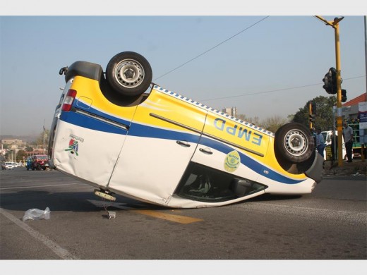 ON ITS ROOF: The overturned EMPD vehicle on the corner of Du Plessis Road and Second Avenue in Florentia.