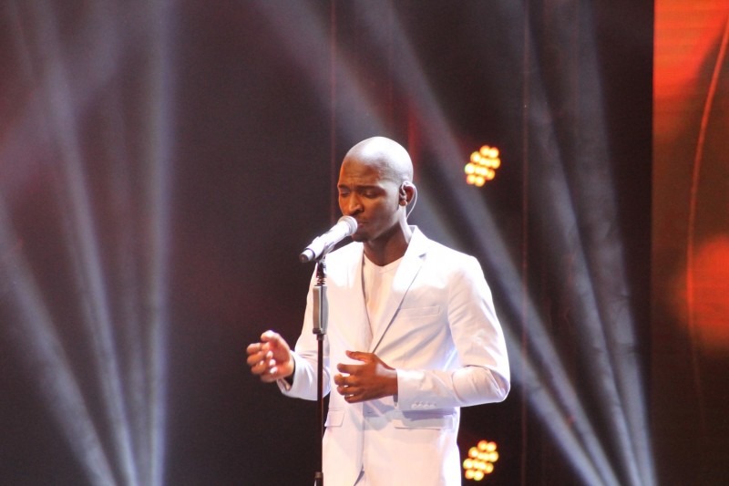 Karabo's opening act, singing a pick from the Producer's choice.