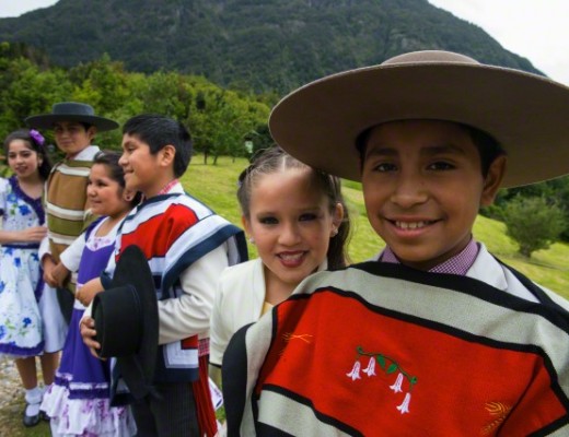 Local children dance group in traditional costumes in Puerto Chacabuco in the Chilean Fjords in southern Chile. Image by © Wolfgang Kaehler/Corbis