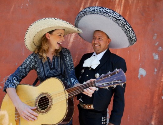This female tourist and her bandmate are wearing sombreros from Mexico.  Image by © Hugh Sitton/Corbis