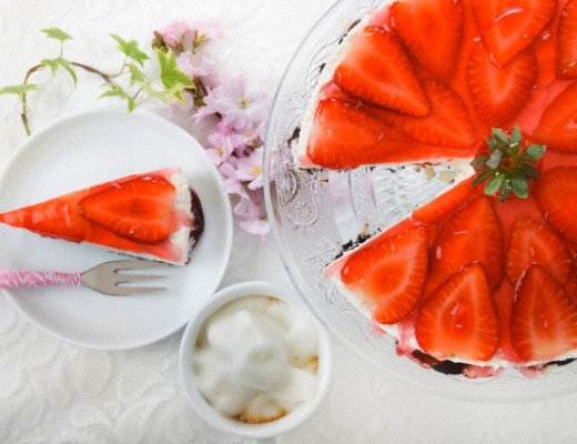 Strawberry cream cheese tart on cake stand and slice of strawberry cream cheese tart, elevated view