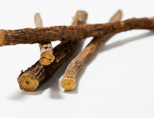 Liquorice roots on wooden background --- Image by © Kröger/Gross/the food passionates/Corbis