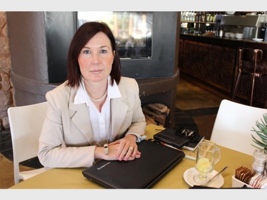 BEAUTIFUL BUSINESSWOMAN: Tanya Dimas, at The Kraal restaurant at the Thaba Eco Hotel, wearing her must-have fashion piece - her whistle in aid of the Blow the Whistle Campaign, that stands against women and children abuse - around her neck.